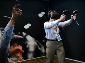 An attendee plays a game on an Oculus Rift virtual reality headset during the Intel Developers Forum