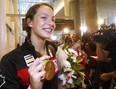 Gold medal winning swimmer Penny Oleksiak arrives back in Toronto after the Rio Olympics.