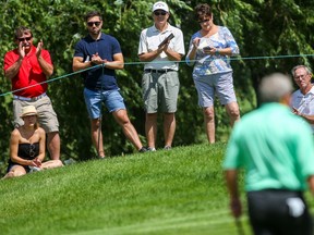 Fans applaud on the 8th hole during the second round of the PGA Tour Champions' 3M Championship golf tournament