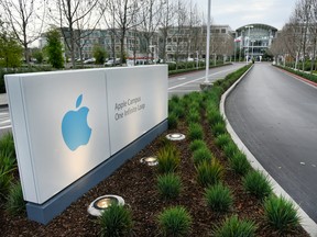 Signage is displayed at the entrance of Apple Inc. headquarters