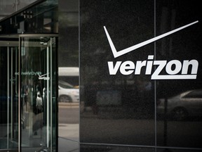 Signage sits on the exterior of a Verizon Communications Inc. store in downtown Chicago, Illinois, U.S.