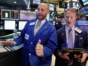 Traders work on the floor of the New York Stock Exchange.