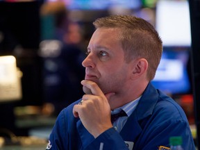 A trader works on the floor of the New York Stock Exchange.