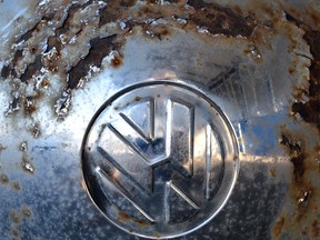 (FILES) This file photo taken on November 04, 2015 shows the logo of German car maker Volkswagen (VW) on the wheel cap of a vintage VW beetle car at a workshop in Usseln, western Germany. One year after 'Dieselgate', Volkswagen (VW) faces lawsuits around the world. So far, VW has refused to compensate Europeans or buy back their vehicles -- as the firm has done for many US customers. Instead, it plans to retrofit the 8.5 million vehicles affected to meet emissions standards honestly. Experts predict that the total bill for Volkswagen could reach between 25 and 30 billion euros, leaving the firm once again raiding its piggy bank but not threatening its survival. / AFP PHOTO / DPA / UWE ZUCCHI / Germany OUTUWE ZUCCHI/AFP/Getty Images