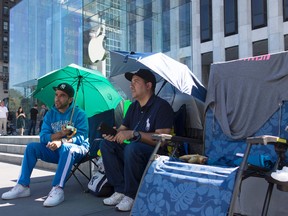 Apple Inc has already sold out of the its iPhone 7 Plus but people wait in the line to buy the iPhones in New York. Phones hit the shelves Friday.