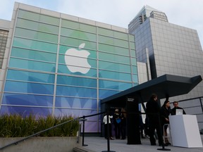 People gather outside Yerba Buena Center for the Arts before an Apple special event on March 9, 2015