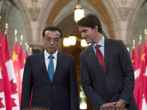 Canadian Prime Minister Justin Trudeau speaks with Chinese Premier Li Keqiang