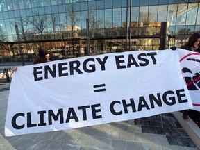 Members of Stop Energy East Halifax protest outside the library in Halifax last year.