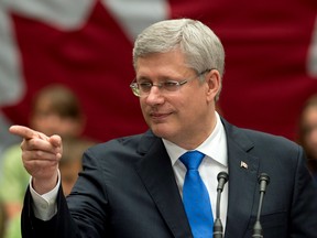Stephen Harper takes a question at the Confederation Centre of the Arts in Charlottetown on June 19, 2014.