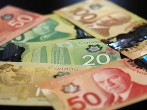 A new survey says 56 per cent of Canadians are just $200 or less per month away from being unable to meet their debts.