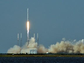 SpaceX's Falcon 9 rocket lifting off with an unmanned Dragon cargo craft from the launch on April 6, 2016.