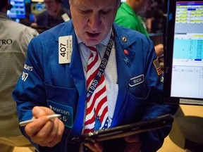 North American markets look headed for a lower open today as oil prices fell and investors reassessed the possibility of a near-term rise in U.S. interest rates.