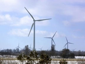 Wind powered turbines spin on a wind farm in Port Burwell, a town near London, Ontario