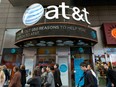 People walk by an AT&T retail store in New York City.