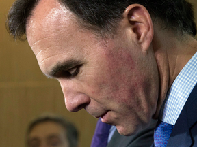 Minister of Finance Bill Morneau listens to a question during a news conference in Ottawa, Thursday, Oct. 20, 2016.