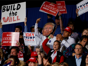 Supporters of Republican presidential candidate Donald Trump cheer during a campaign rally