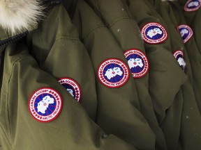 Jackets hang at the factory of Canada Goose Inc. in Toronto on Thursday, November 28, 2013.