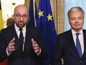 Belgian Prime minister Charles Michel, left, and Foreign Minister Didier Reynders give a joint press conference after the meeting of all Belgium federal entities on the EU-Canada Comprehensive Economic and Trade Agreement (CETA) in Brussels on October 27. Belgian political leaders have reached a consensus in support of the EU-Canada trade deal, Michel said, raising hopes it can be signed soon.