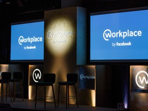 The Workplace by Facebook logo sits on screens ahead of the global launch event