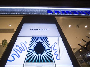 An electronic screen displays an advertisement for Samsung Electronics Co. Galaxy Note 7 smartphones outside a Samsung Partnershop retail store at night in Hong Kong, China, on Tuesday, Oct. 11, 2016. Samsung Electronics Co. is ending production of its problematic Galaxy Note 7 smartphones, taking the drastic step of killing off a smartphone that became a major headache for South Korea's largest company.