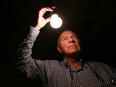 Gordon Marasco a retired electrical engineer poses in the basement of his Pelham, Ont. home. Marasco, who gets his electricity from Hydro One, said that five years ago Hydro One reclassified his area from "high density" to "medium density" and his electric bill went up 20%. Just down the street, his neighbours have a different distribution company, Niagara Peninsula Energy, and much cheaper rates.