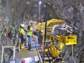 K92 CEO Ian Stalker underground with drill rig at Irumafimpa Gold Deposit