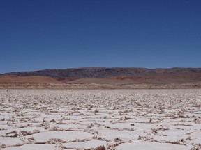 Salars are dried or drying lake beds whose crystalline surfaces are the result of wind and natural deposition by receding waters.