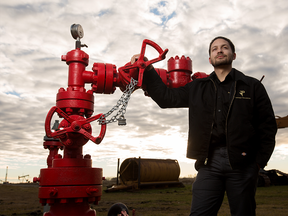 Mitchell Pomphrey with the former oil well he's converting as a geothermal heat source, at the Leduc #1 Energy Discovery Centre near Devon, Alta., outside of Edmonton.