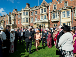 Queen Elizabeth II greets guests during a garden party at the Queen's Sandringham Estate in Norfolk. Under Brexit, the estate would lose £700,000 in farm subsidies from the EU.