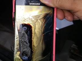 This Friday, Oct. 7, 2016, photo provided by Andrew Zuis, of Farmington, Minn., shows the replacement Samsung Galaxy Note 7 phone belonging to his 13-year-old daughter Abby, that melted in her hand earlier in the day.