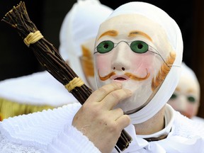 "Gilles" in traditional costume parade during the carnival in the streets of Binche on February 21, 2012, the Shrove Tuesday (Mardi Gras). The Binche Carnival tradition is one of the most ancient and representative of Wallonia was inscribed in 2008 on the Representative List of the Intangible Cultural Heritage of Humanity by UNESCO.
