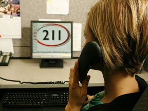 A staff member takes a call at the Calgary Distress Centre in a file photo from 2009.