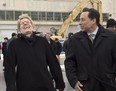 Ontario Premier Kathleen Wynne and Minister of Economic Development and Growth Brad Duguid share a laugh after a groundbreaking ceremony for the Centennial College Downsview Aerospace Campus in Toronto on Monday November 21, 2016