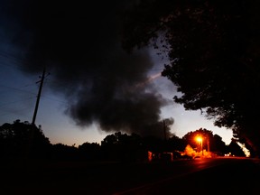 A plume of smoke from a Colonial Pipeline explosion on Monday in Helena, Ala. The blast shut that killed one worker and injured five shut the largest fuel pipeline in the U.S.