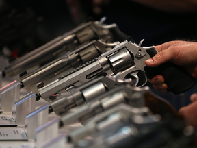 Smith and Wesson handguns are displayed during an NRA Annual Meeting & Exhibits in Nashville, Tenn.