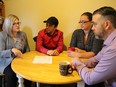 Ontario NDP Leader Andrea Horwath, left, and City Coun. Brian White, right, chat with Shaun and Maygin Evans at their home  in Sarnia, Ont., on Nov. 9, 2016.