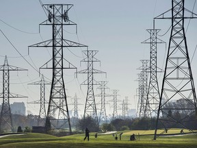 Hydro towers are seen over a golf course in Toronto in a 2015 file photo.