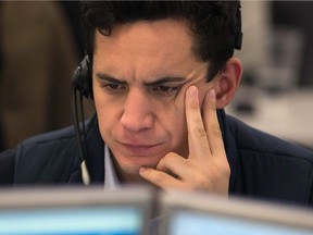 A trader from ETX Capital works in London following the result of the US presidential election.