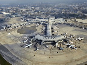 Toronto-Pearson International Airport. Note the dark outline of the old (1964) Aeroquay structure still visible on the tarmac between Piers E and F of Terminal 1