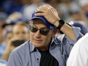 Charlie Sheen reacts during Game 4 of the National League baseball championship series.