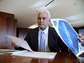 Energy Transfer Partners CEO Kelcy Warren reviews documents at his office in Dallas on  the Dakota Access oil pipeline that is mired in controversy after thousands of protestors sought to block its expansion underneath a water source close to the Standing Rock Sioux Indian Reservation in North Dakota. President-elect Donald Trump holds stock in the company.