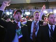 Supporters of Republican presidential nominee Donald Trump reacts to early results during election night.