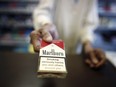A "Smoking Kills" logo sits on a packet of Marlboro cigarettes, produced by Philip Morris International
