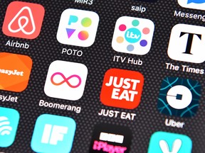 The Just Eat app logo is displayed on an iPhone on August 3, 2016 in London, England.