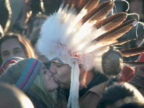 Native American and other activists celebrate after learning an easement had been denied for the Dakota Access Pipeline at Oceti Sakowin Camp on the edge of the Standing Rock Sioux Reservation on Dec. 4, 2016 outside Cannon Ball, N.D.