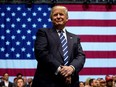 President-elect Donald Trump smiles during a rally at DeltaPlex Arena in Grand Rapids, Mich.