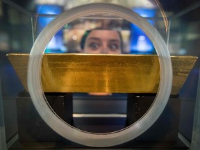 A visitor looks at a gold bar displayed at the Money Museum of the Bundesbank in Frankfurt am Main, central Germany.