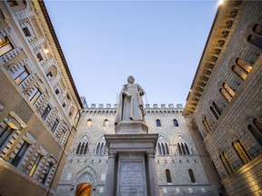 The statue of Sallustio Bandini, an economist and politician, stands in Piazza Salimbeni in front of the Monte dei Paschi di Siena SpA bank headquarters in Siena, Italy.
