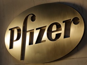 British regulators fined U.S. drugmaker Pfizer and distributor Flynn Pharma a record 89.4 million pounds (US$112.7 million) Wednesday for increasing the cost of an epilepsy drug by as much as 2,600 per cent.