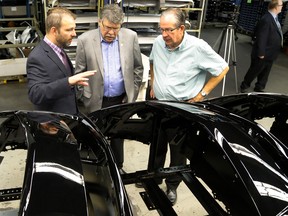 Director of manufacturing Brad Delorme chats with MPP Jeff Leal and Peterborough County Warden J. Murray Jones as they tour the Ventra Plastics facility on Wednesday August 31, 2016 in Peterborough, Ont.